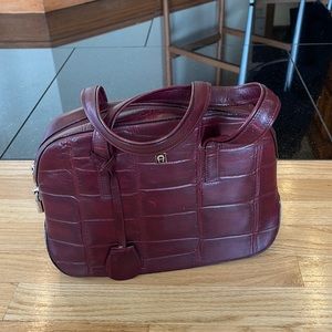beautiful great size burgundy aigner handbag.